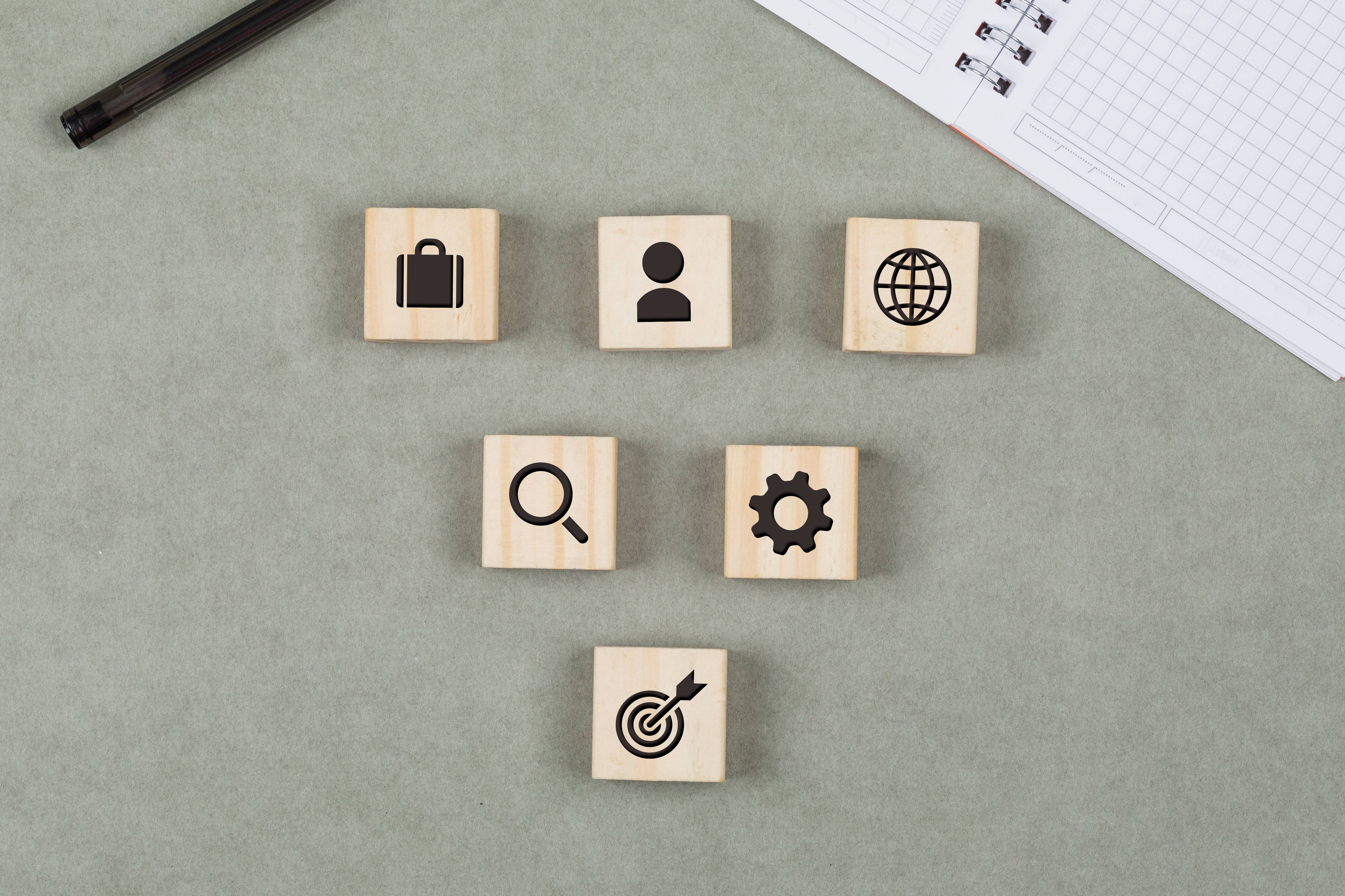 financial-concept-with-wooden-cubes-pen-notebook-grey-background-flat-lay.jpg (5273×3515)